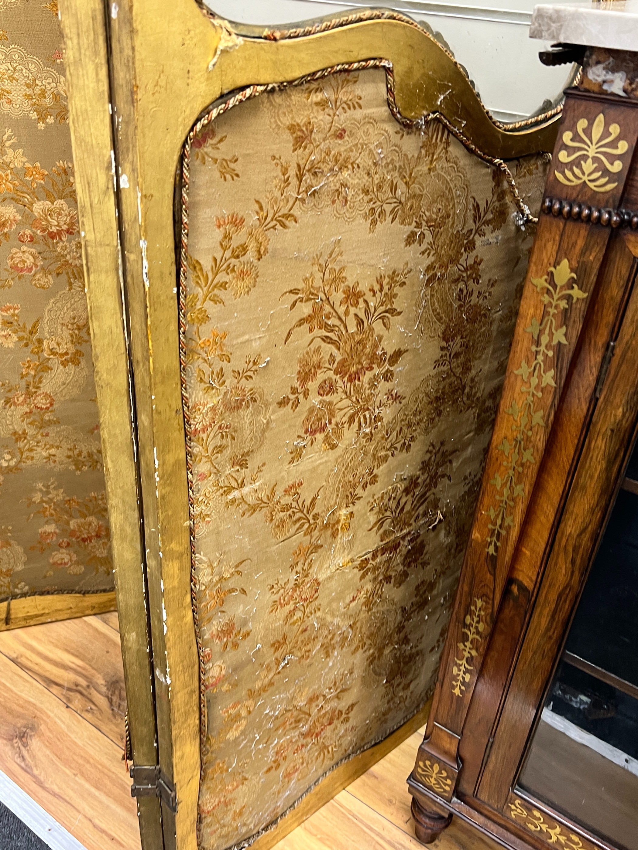A Louis XV style carved glazed giltwood three fold dressing screen, height 185cm